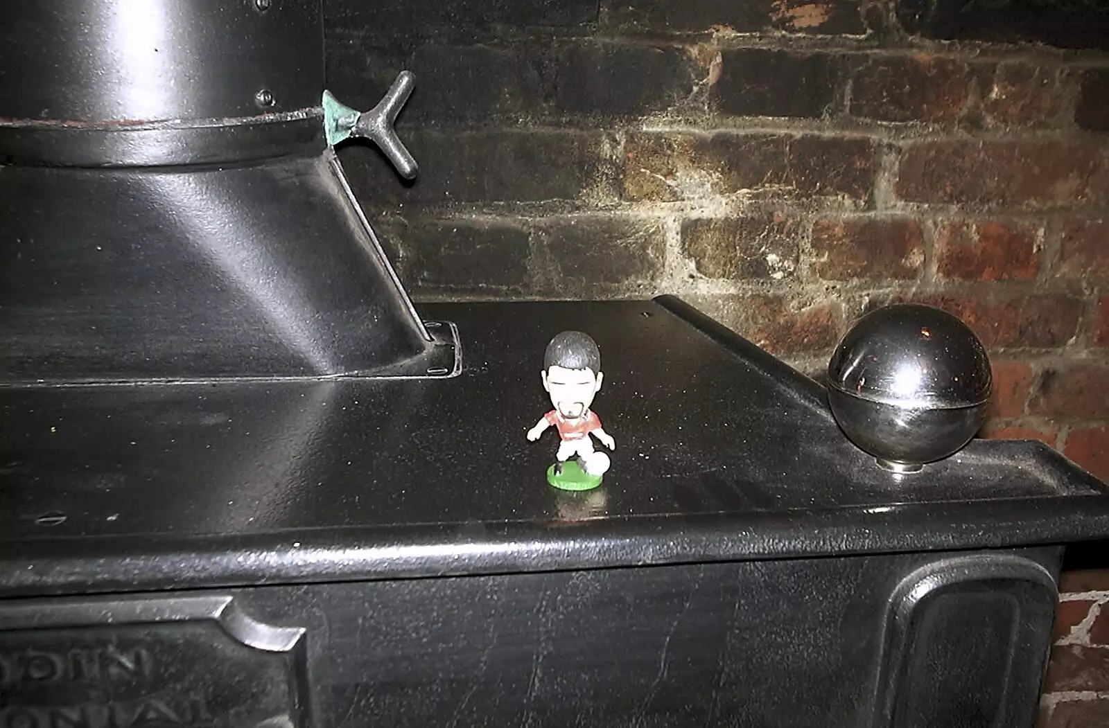 The tiny Roy Keane has appeared on the woodburner, from Twenty Years at The Swan Inn, Brome, Suffolk - 15th November 2003