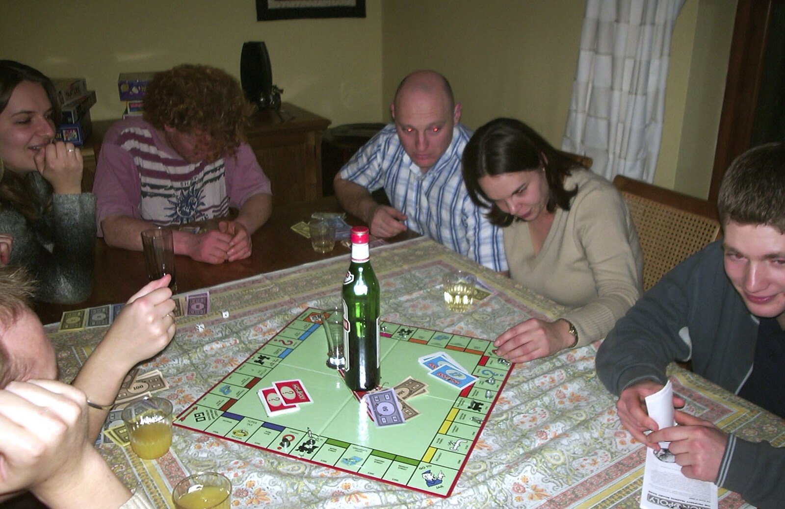 Drinking Monopoly kicks off in the dining room from Sarah's Games Night at Anne's, Thornham, Suffolk - 27th December 2003