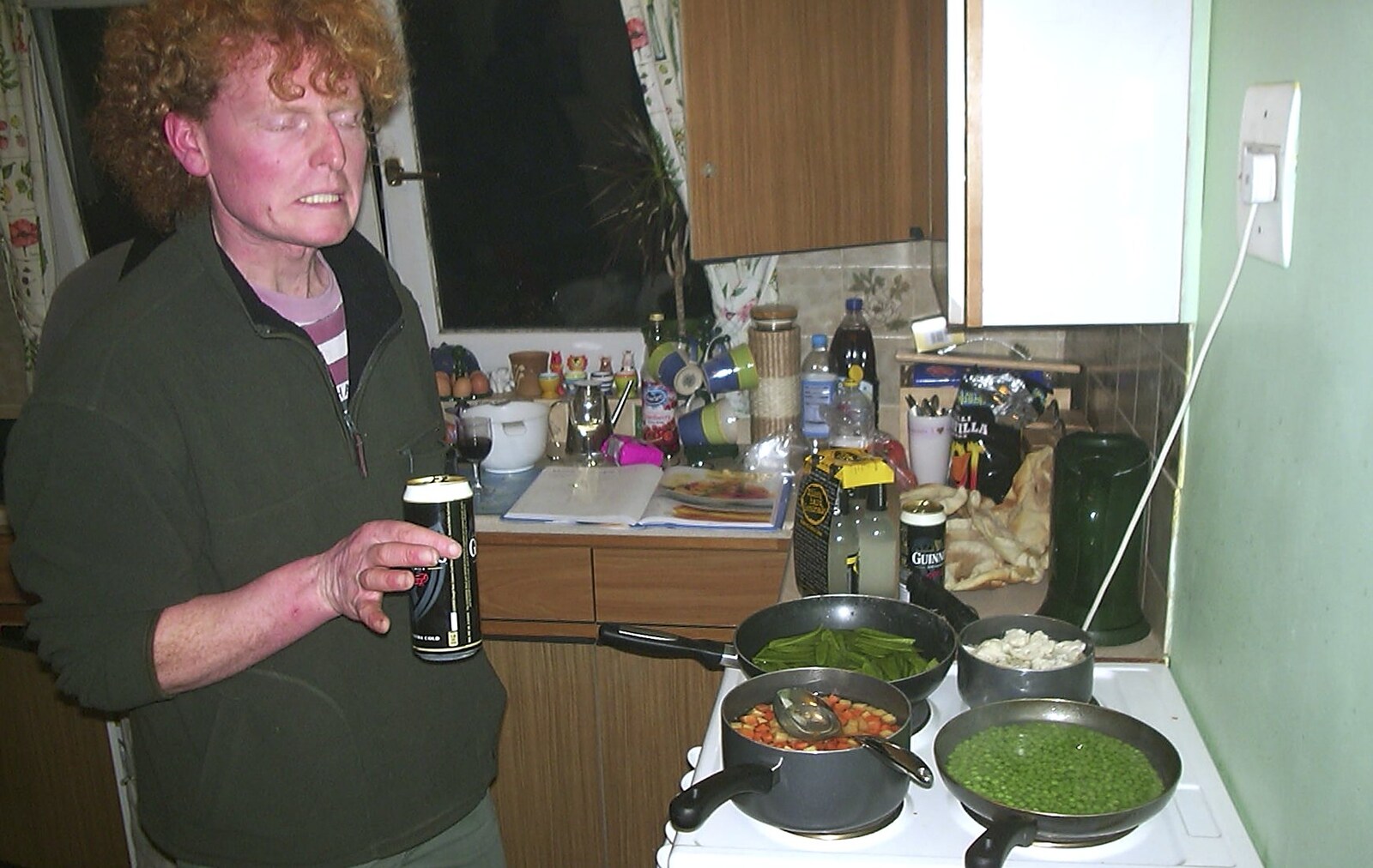 Mikey-P and Clare's House-Warming Thrash, Eye, Suffolk - 17th January 2004: Wavy watches the veg over a can of Guiness
