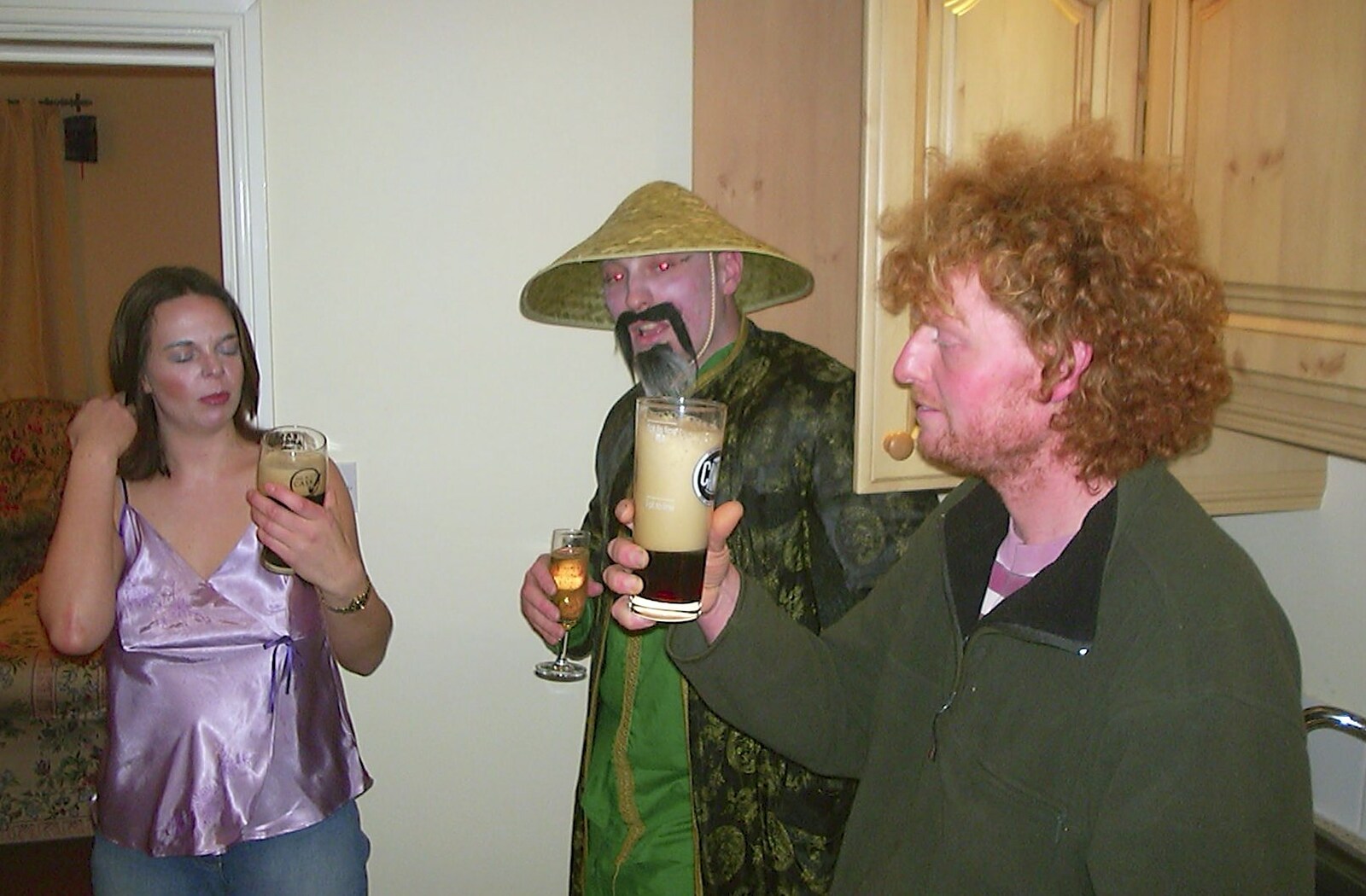 Wavy holds up a foaming pint from A Chinese-themed Murder Mystery, Eye, Suffolk - 7th February 2004
