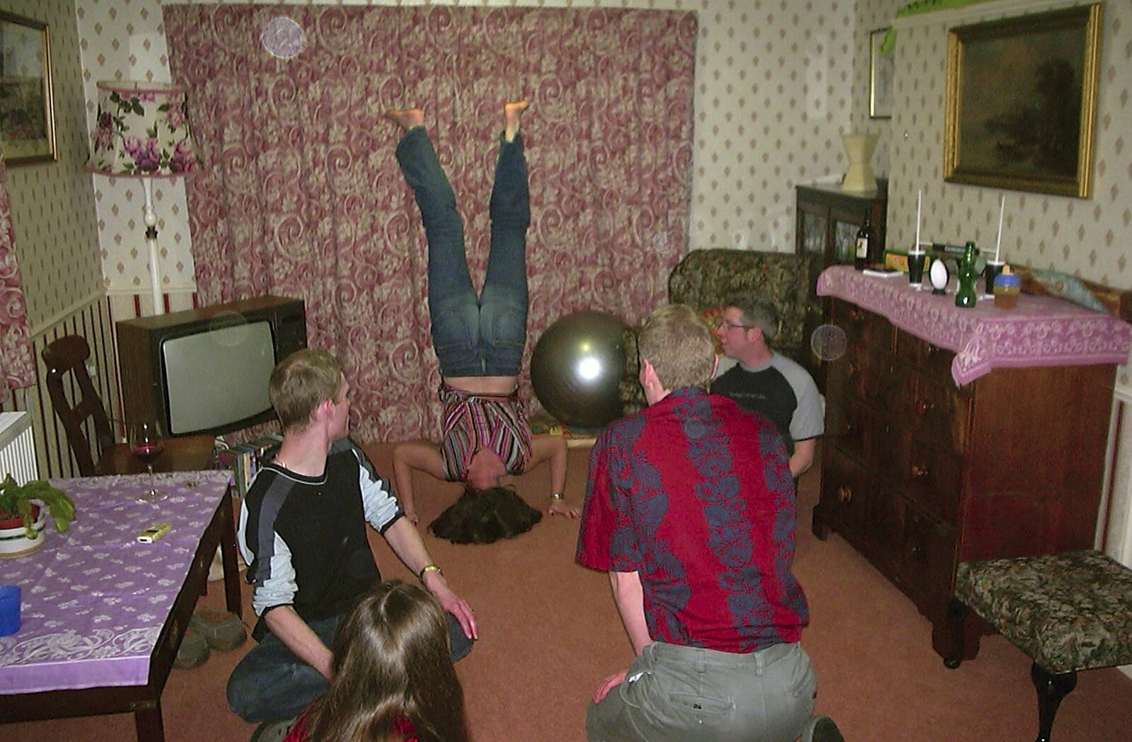 Jen does a head-stand from Jess and Jen's Party, Pulham St. Mary, Norfolk - 28th February 2004