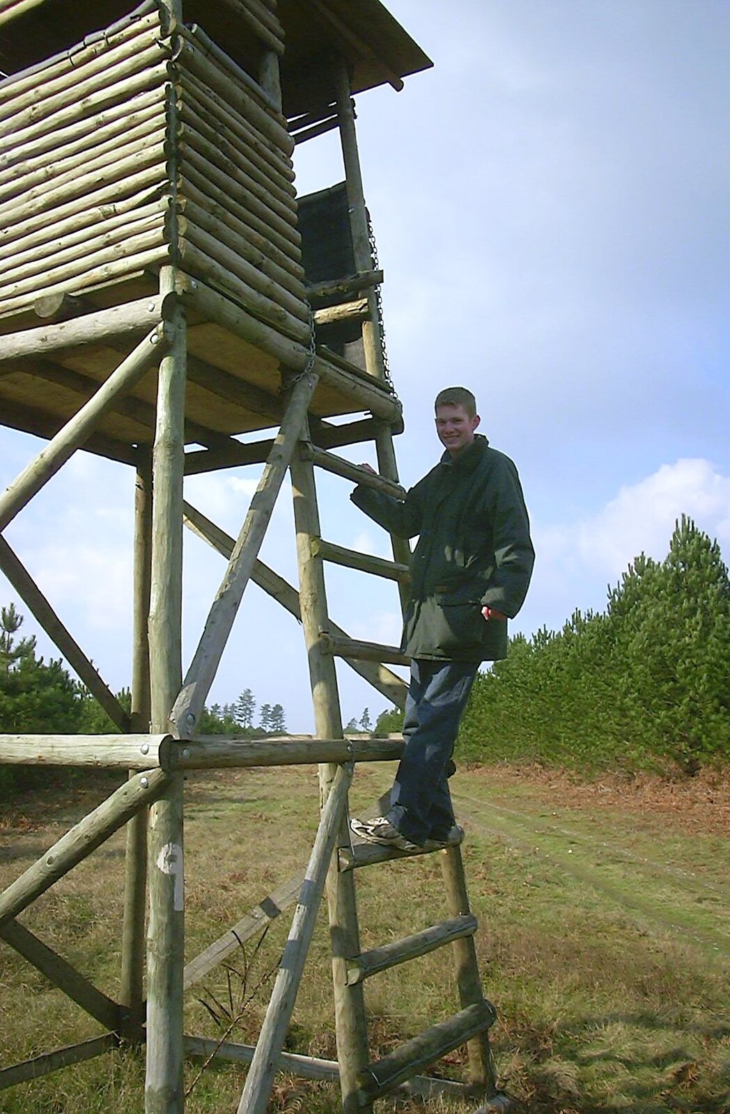 The Boy Phil climbs a tower from A day at the Husky Races, Lakenheath, Suffolk - 29th February 2004