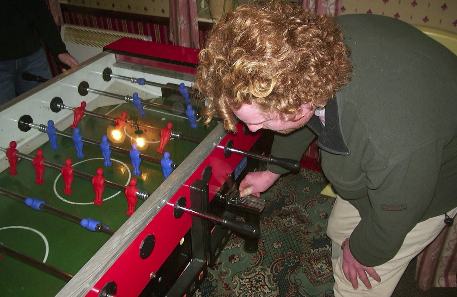Wavy feeds the table-football machine from Fire Training and Lorraine's New Sprog, Cambridge and Brome - 10th March 2004