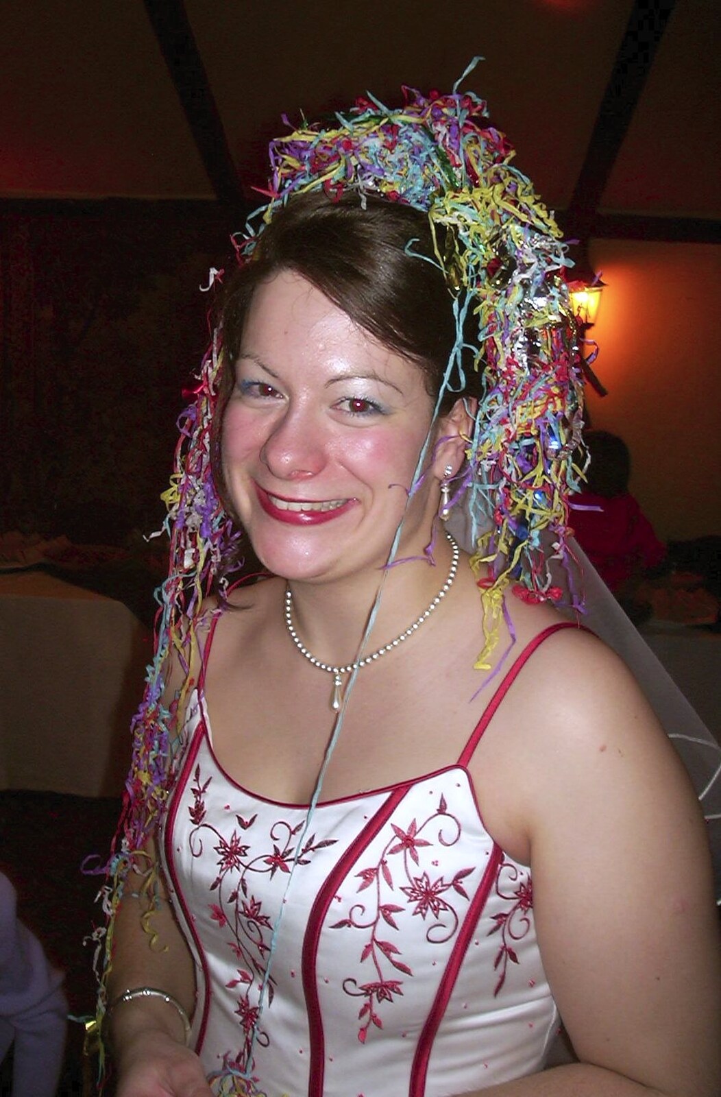 Clare with a full complement of head-streamers from Mikey-P and Clare's Wedding Reception, Brome Grange, Suffolk - 20th March 2004