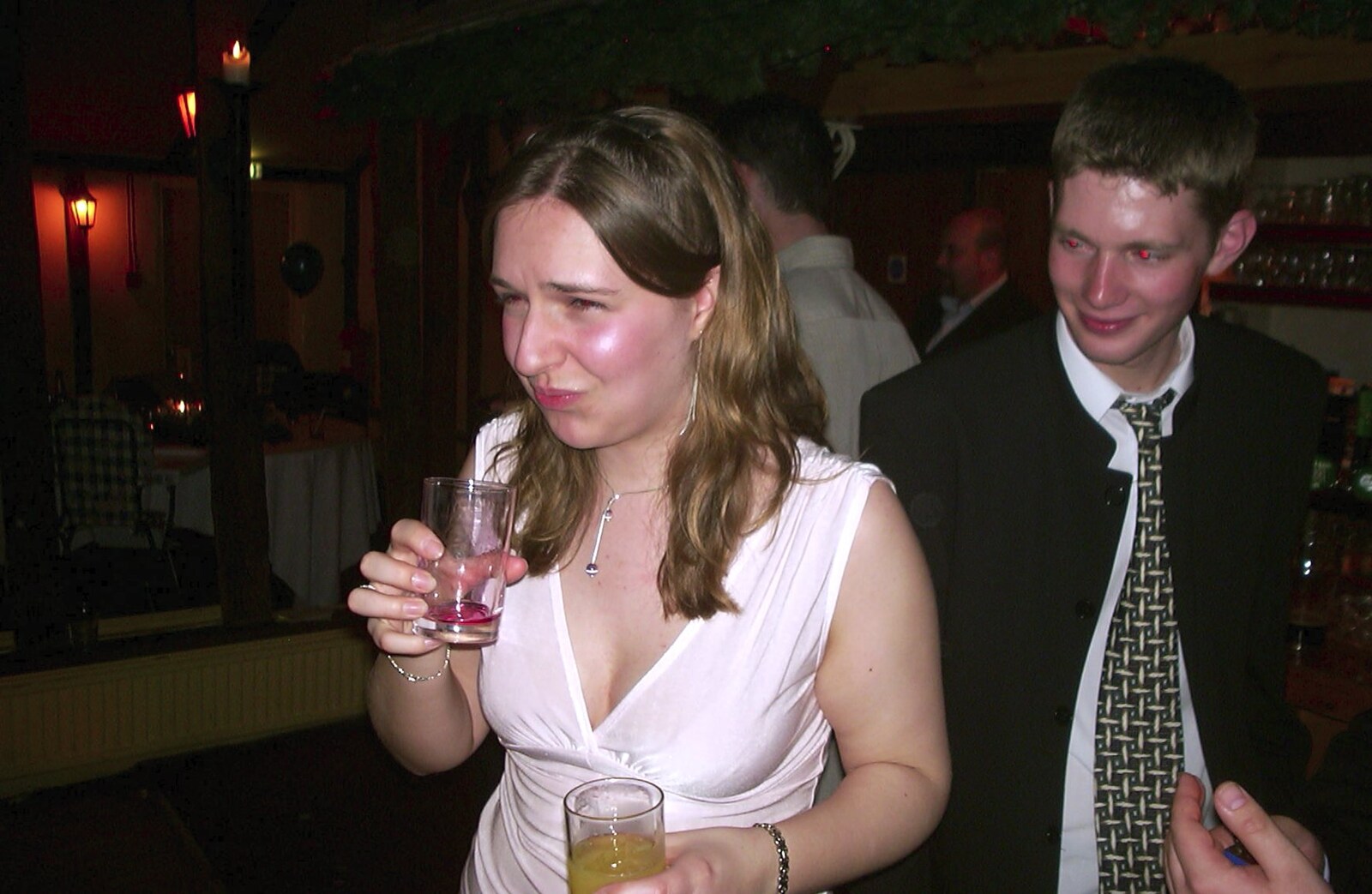 Jess isn't sure about her drink from Mikey-P and Clare's Wedding Reception, Brome Grange, Suffolk - 20th March 2004