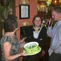 Paul and Claire's Engagement Party, Brome Swan, Suffolk - 27th March 2004, The cake does a tour