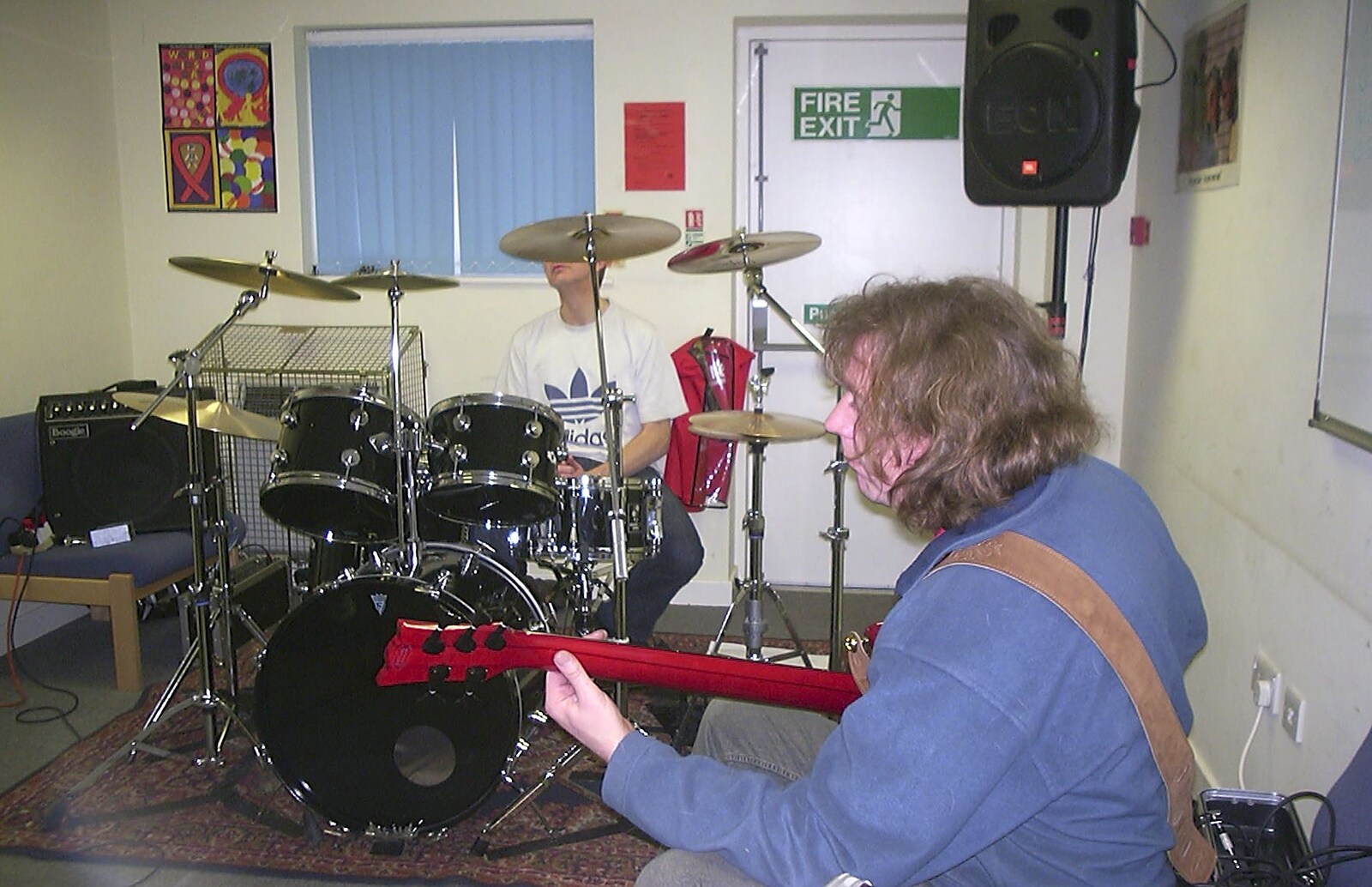 Max tunes up his bass from A March Miscellany: The BBs, Pulham Pubs and Broken Cars - Norfolk and Cambridgeshire, 31st March 2004