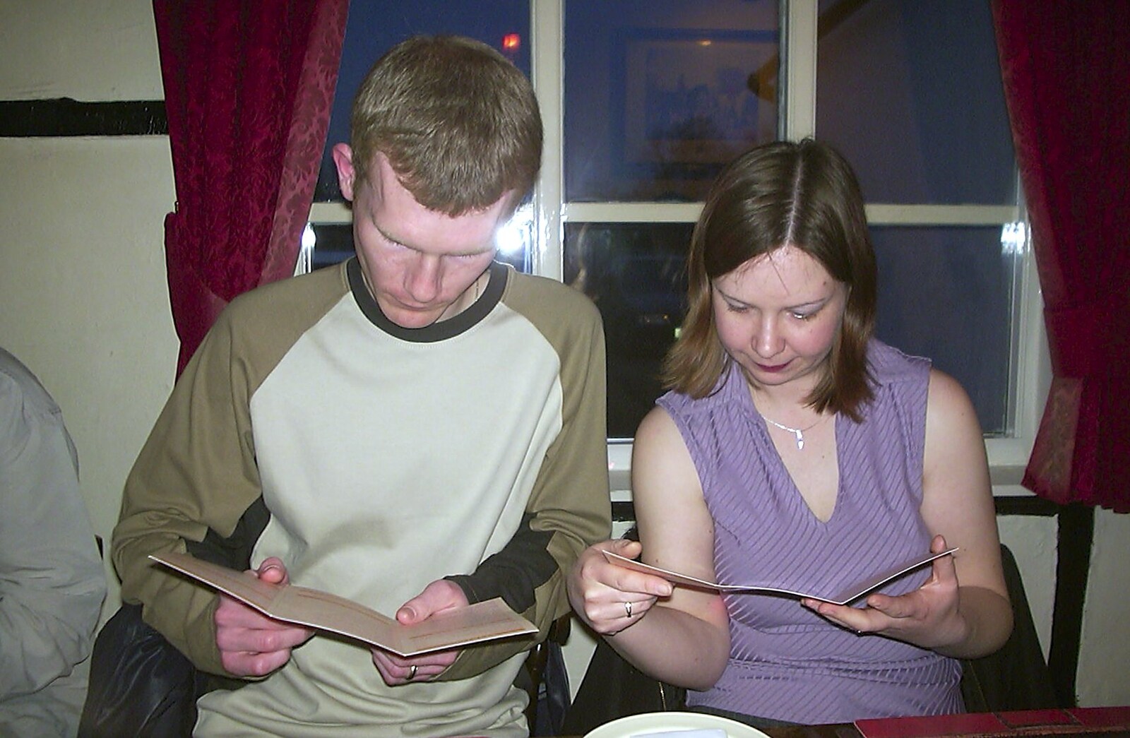 Andy and Jackie consult the menus from Jess's Birthday Do, The King's Head, Pulham St Mary, Norfolk - 3rd April 2004