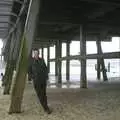 Nosher leans against the pier supports, Moping in Southwold, Suffolk - 3rd April 2004