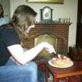 Jess cuts her cake (after moving the icing teddy bears out of the way)