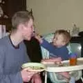 Tyler feeds Andy a bit of burger, Jess's Post-Birthday Barbeque and a Walk Around Pulham - 4th April 2004