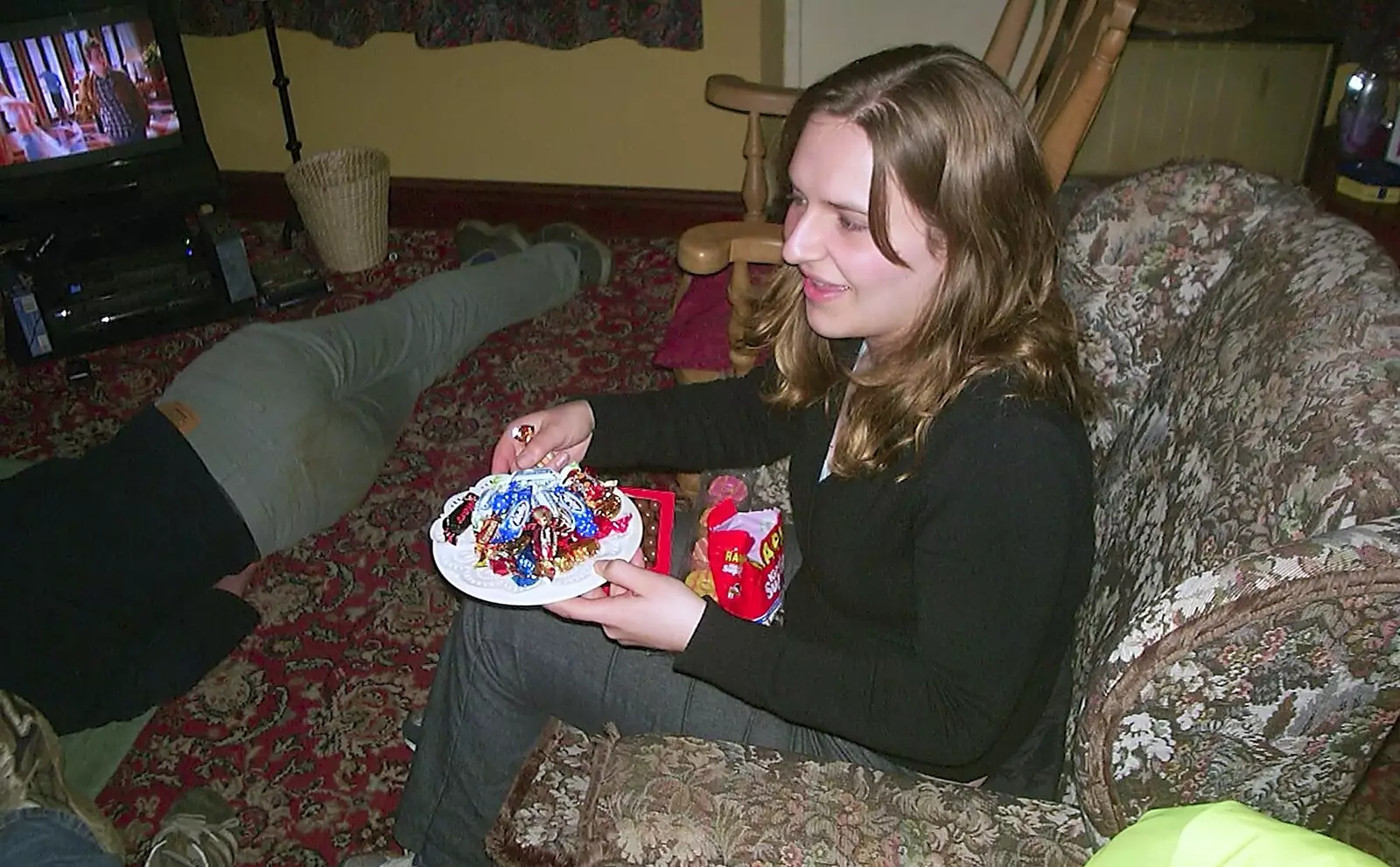 Jess has a plate of Celebration mini-chocolates, from The BSCC Easter Bike Ride, Thelnetham and Redgrave, Suffolk - 10th April 2004