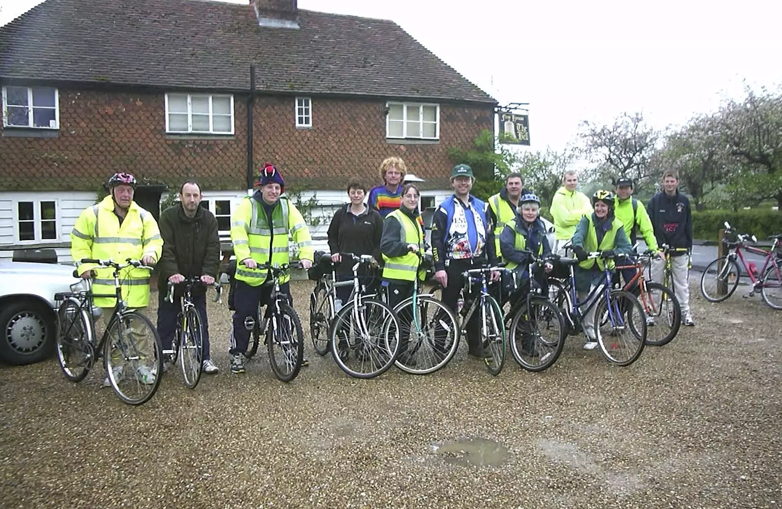 A group photo outside the pub, which is closed, from The BSCC Annual Bike Ride, Lenham, Kent - 8th May 2004