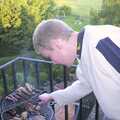 Bill checks some sausages on the fire escape, Trigenix Mexican and a Fire-Escape Barbeque, Eye, Suffolk - 22nd May 2004