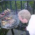 Bill checks on barbeque B, Trigenix Mexican and a Fire-Escape Barbeque, Eye, Suffolk - 22nd May 2004