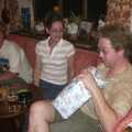 Marc gets first go at 'pass the parcel', Wavy's Birthday at the Swan Inn, Brome, Suffolk - 24th May 2004