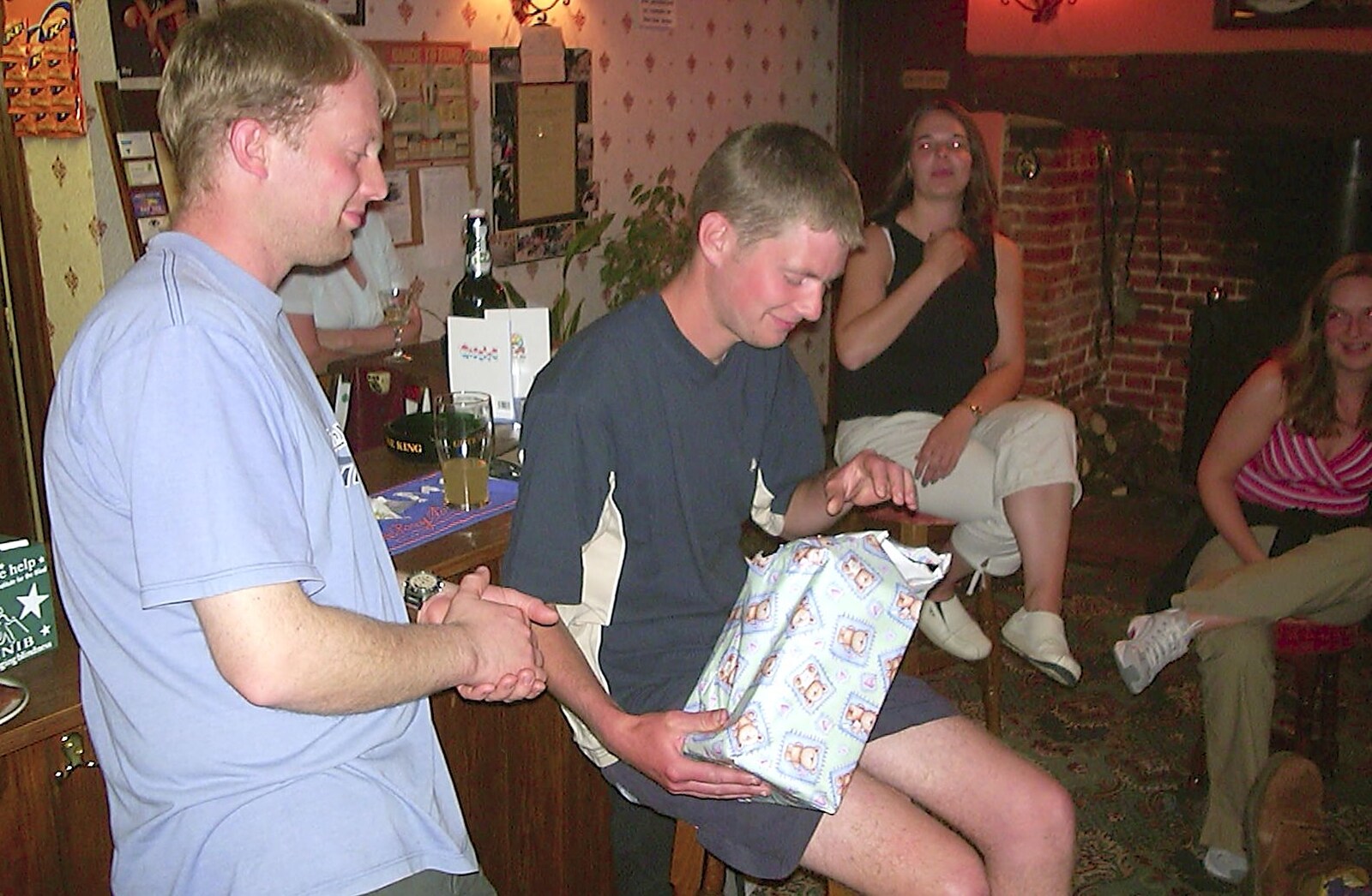 It's Phil's turn on 'pass the parcel' from Wavy's Birthday at the Swan Inn, Brome, Suffolk - 24th May 2004
