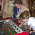 Marc and Suey are on the table football, Wavy's Brome Swan Birthday and Mother and Mike Visit, Aldringham, Suffolk - 24th May 2004