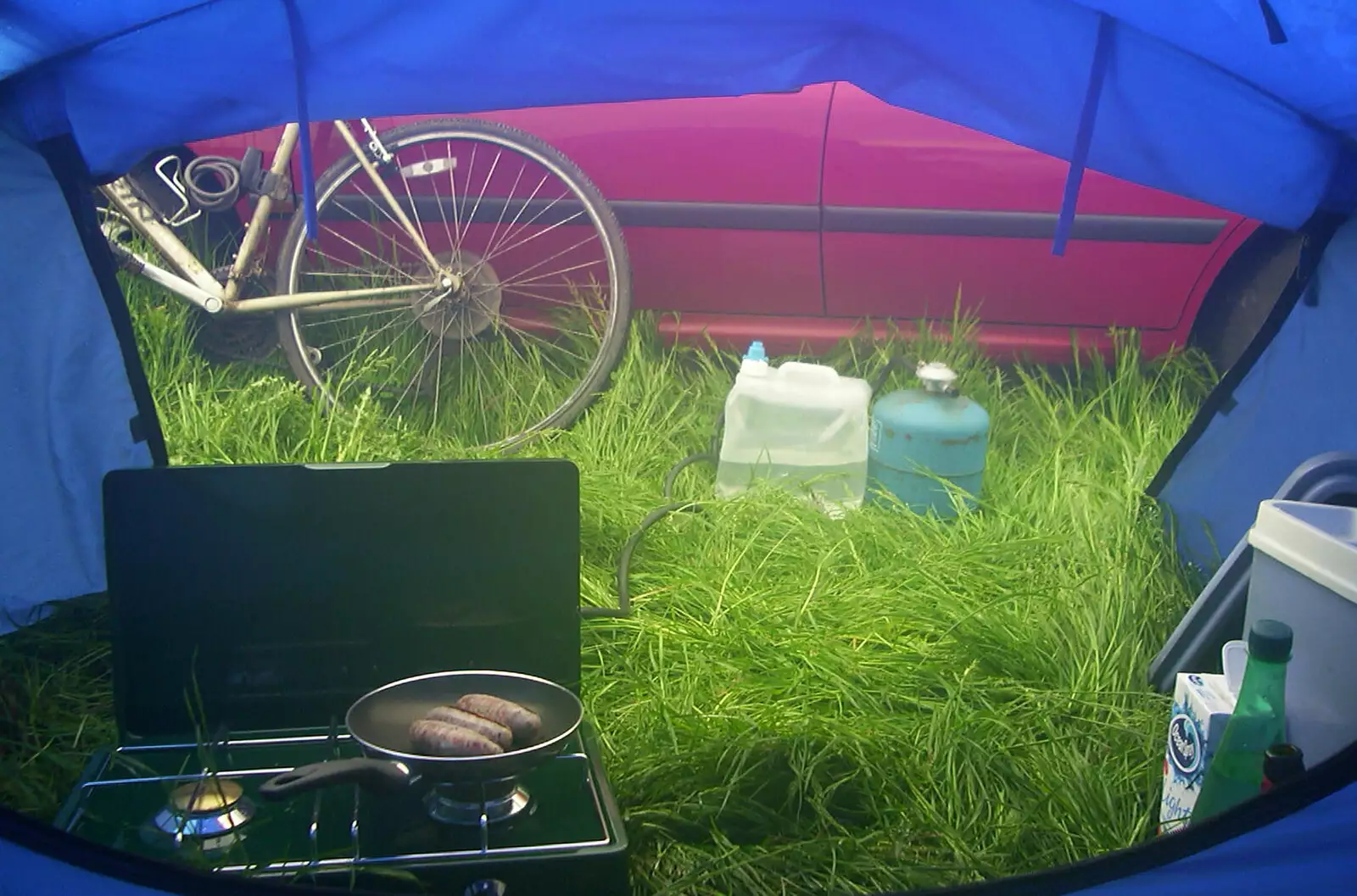 The view out of the tent, and frying sausages, from Corfe Castle Camping, Corfe, Dorset - 30th May 2004