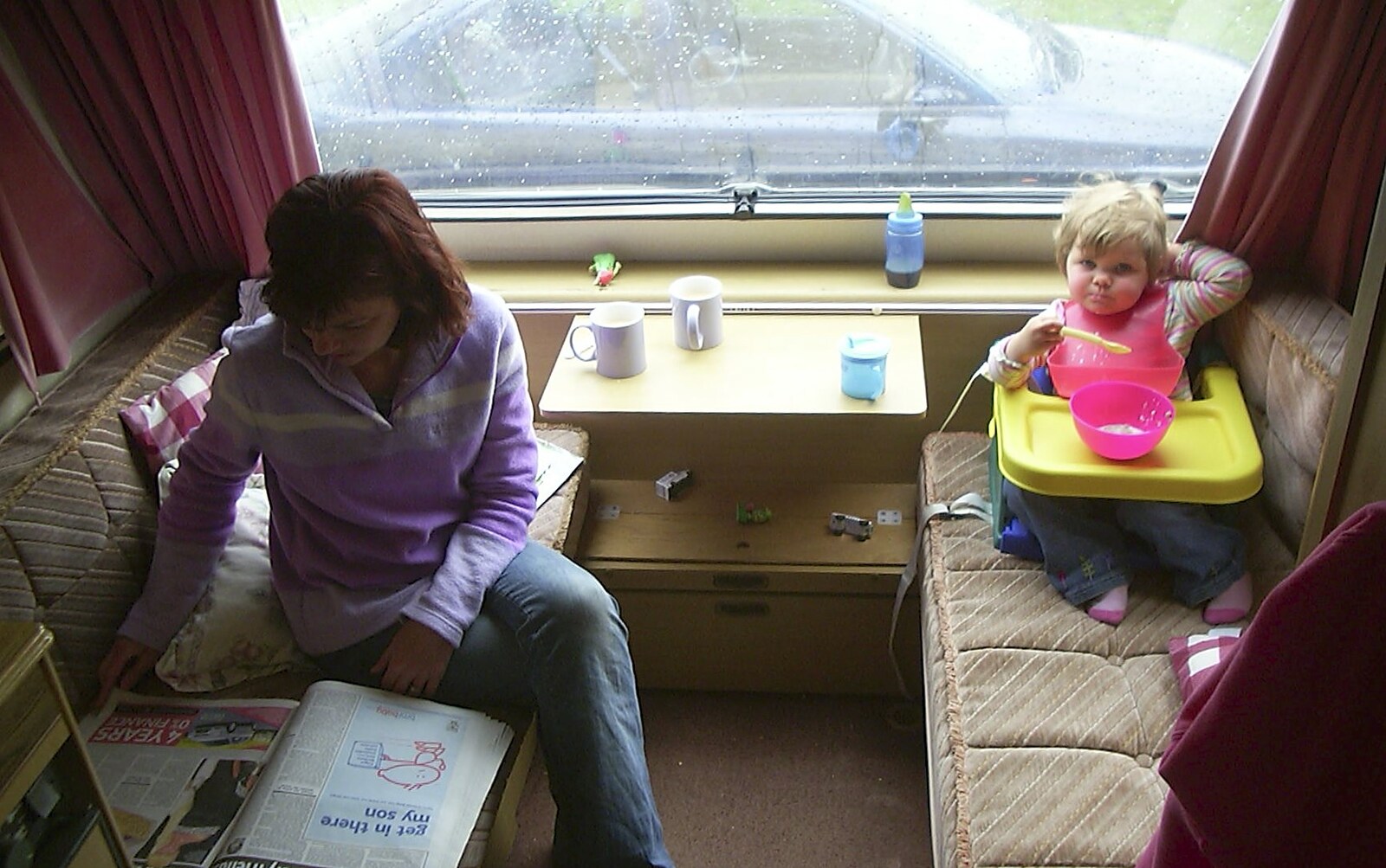 Corfe Castle Camping, Corfe, Dorset - 30th May 2004: Michelle and Sydney in the caravan