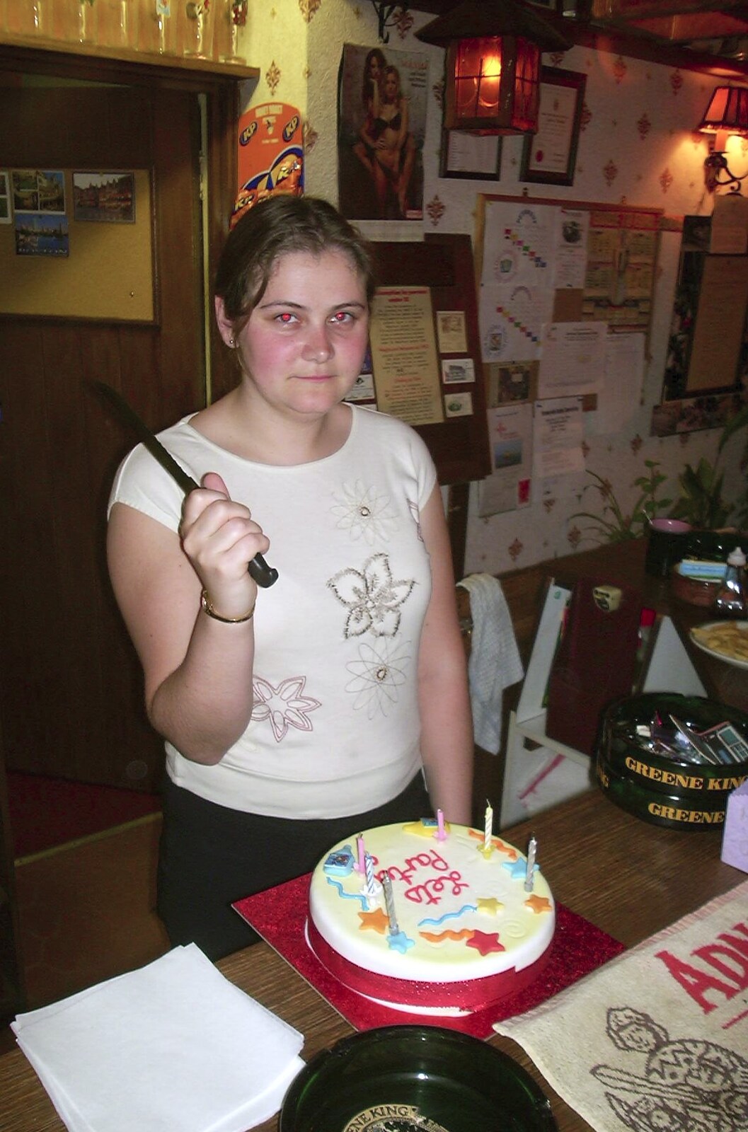 Claire's got a birthday cake. And a knife. from A Transit of Venus and a Front Garden Barbeque, Brome - 11th June 2004
