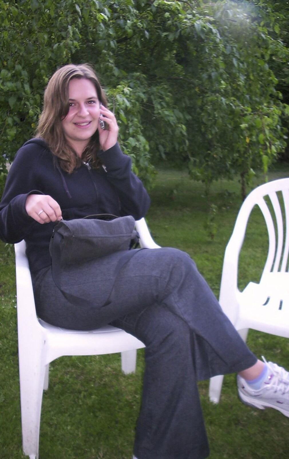 Jess is on the phone from A Transit of Venus and a Front Garden Barbeque, Brome - 11th June 2004