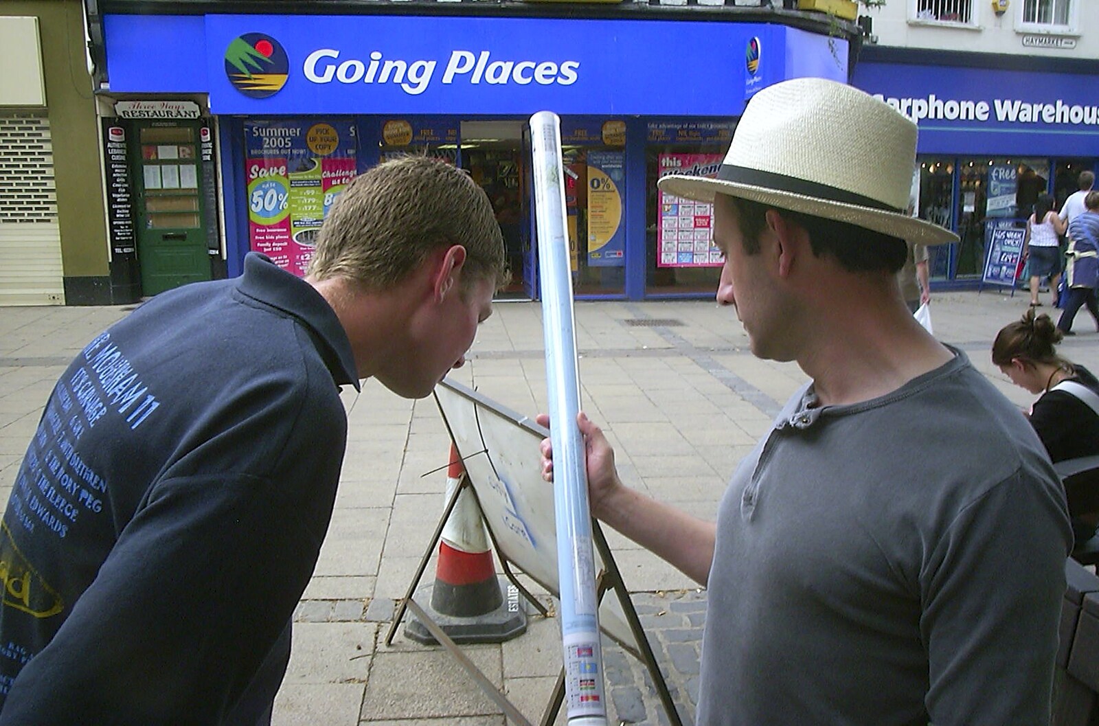 Phil and DH look at a world map outside Going Places from Longview at the Waterfront, and a Trip to the Shops, Norwich, Norfolk - 27th June 2004