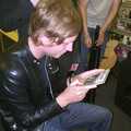 Rob inspects another CD, Longview play Revolution Records, Diss, Norfolk - 2nd July 2004