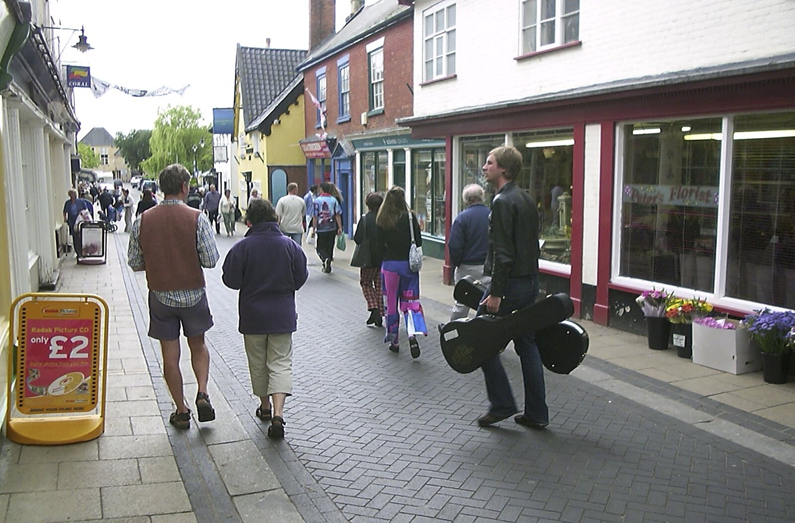 Rob carries a couple of guitars up Mere Street from Longview play Revolution Records, Diss, Norfolk - 2nd July 2004