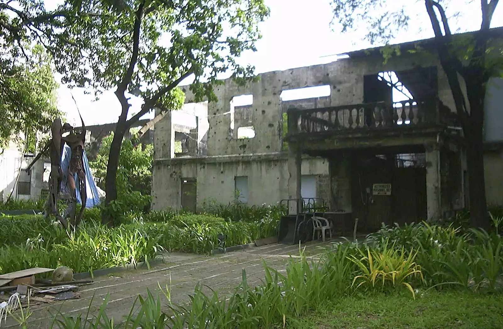 An admin building has bullet holes from the war, from A Postcard From Manila: a Working Trip, Philippines - 9th July 2004