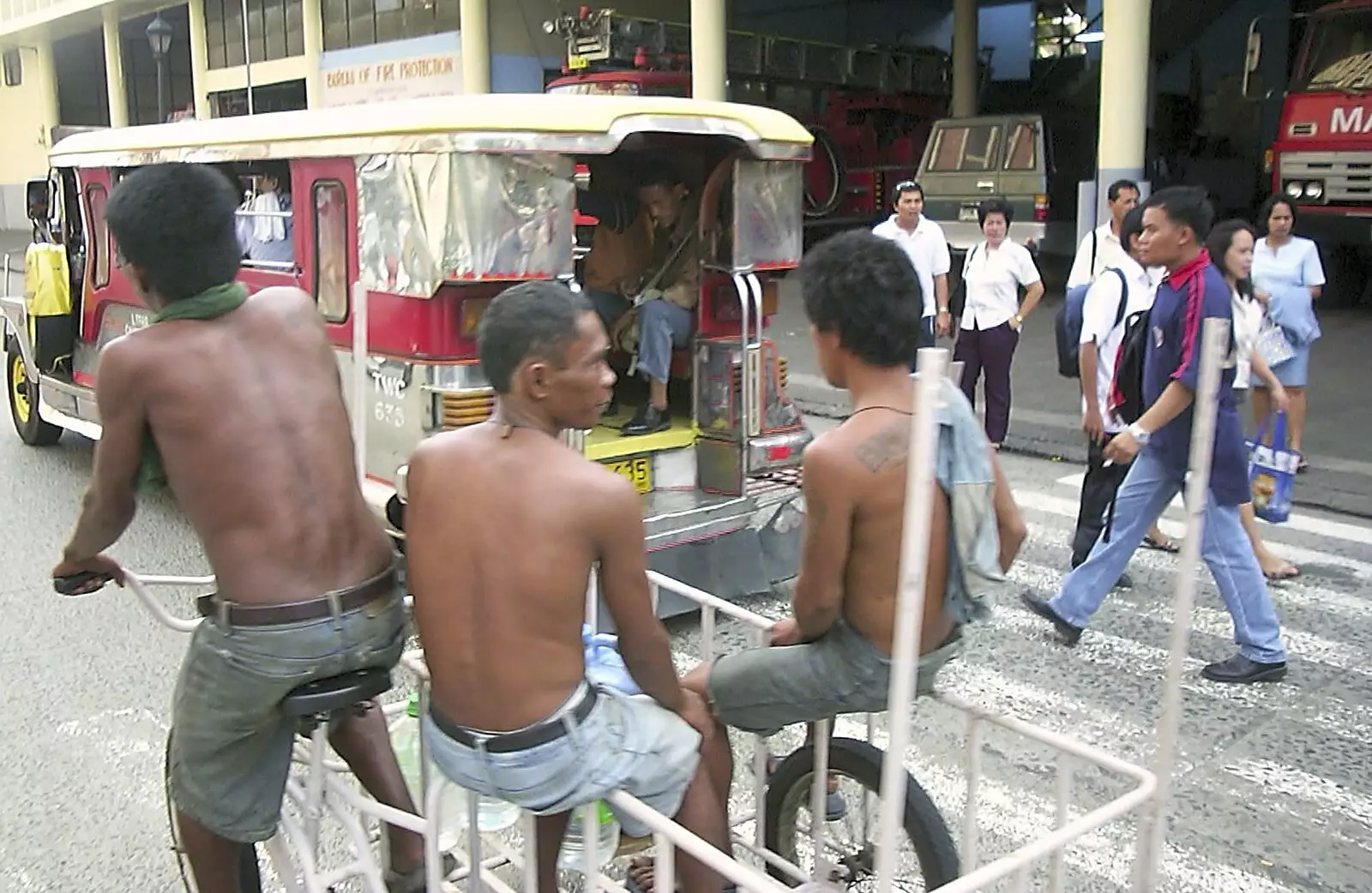 Some dudes in a rickshaw cycle past, from A Postcard From Manila: a Working Trip, Philippines - 9th July 2004