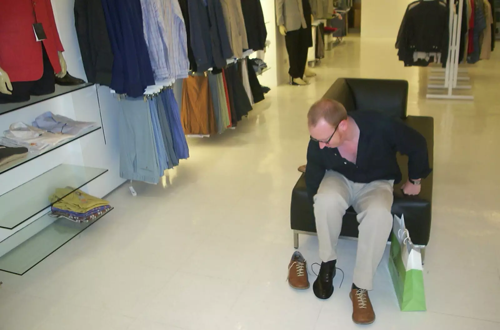 Julian tries shoes in a fancy shopping mall, from A Postcard From Manila: a Working Trip, Philippines - 9th July 2004