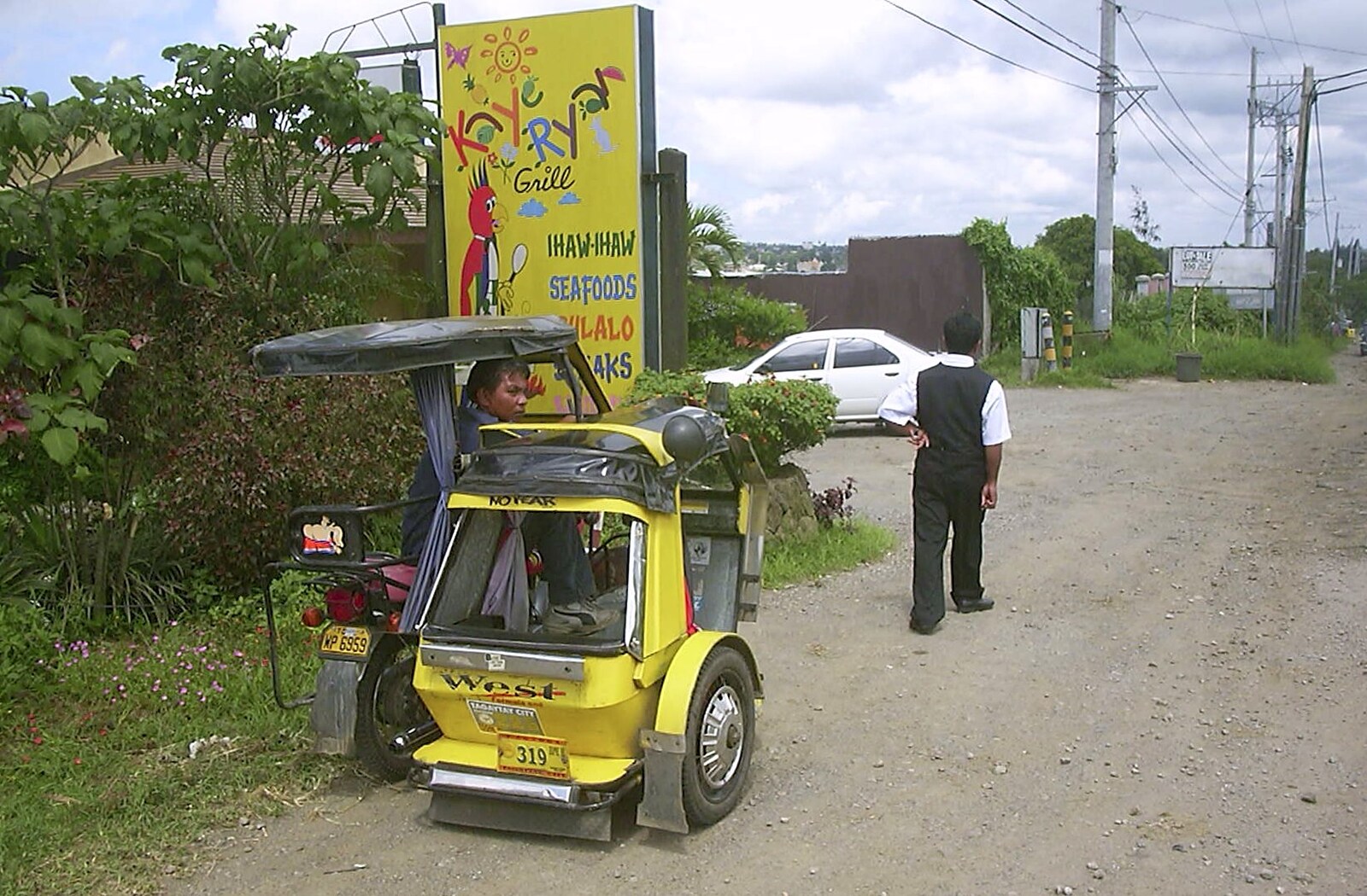 Nosher's driver Dinu wanders back to the car from A Postcard From Manila: a Working Trip, Philippines - 9th July 2004