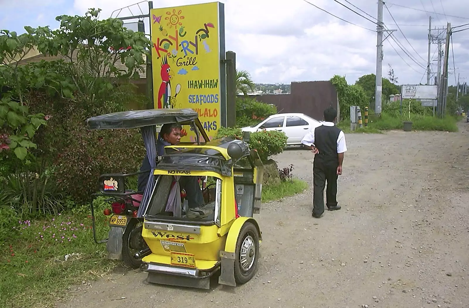 Nosher's driver Dinu wanders back to the car, from A Postcard From Manila: a Working Trip, Philippines - 9th July 2004