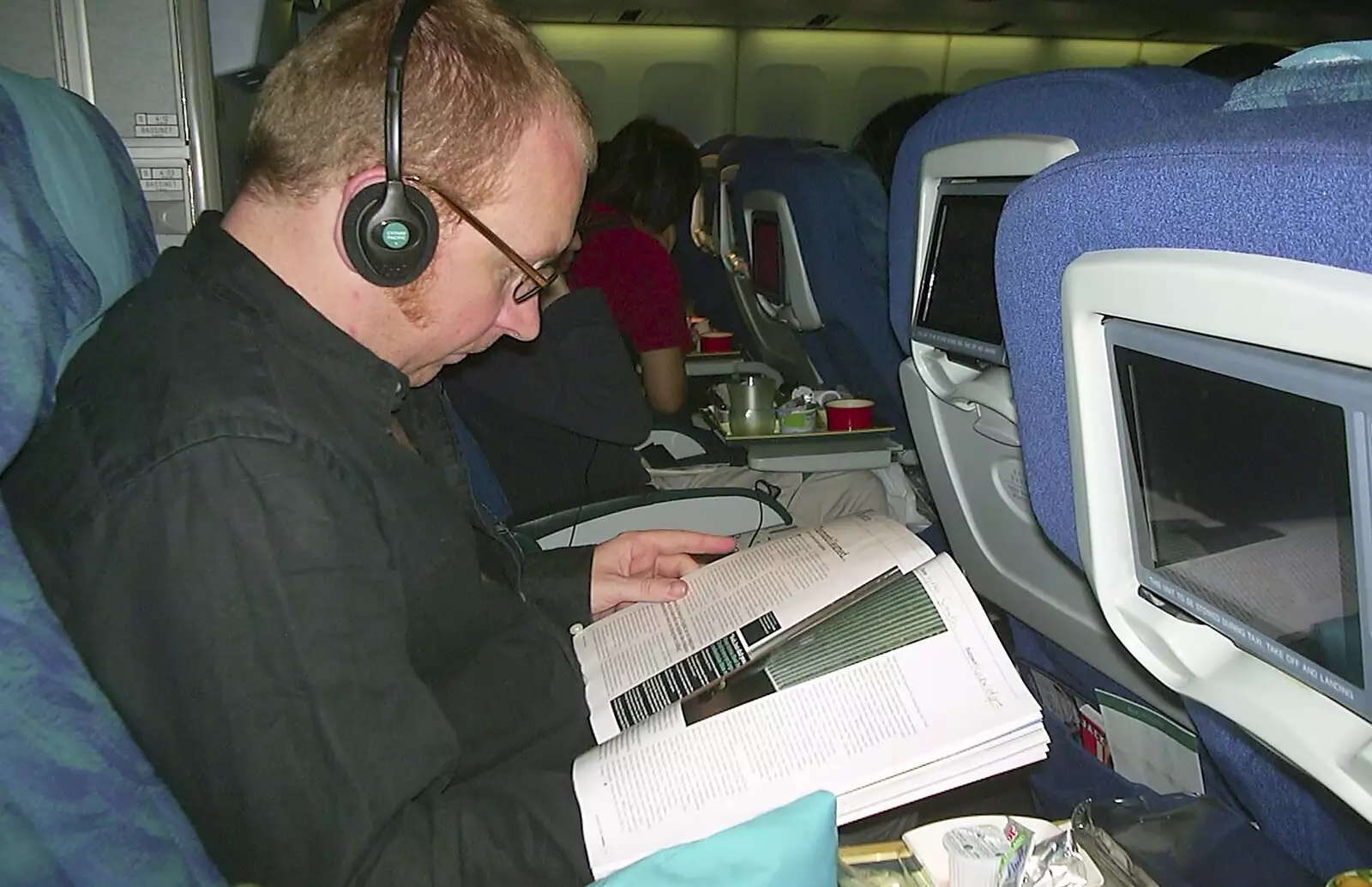 Julian on the plane, as we head back to the UK, from A Postcard From Manila: a Working Trip, Philippines - 9th July 2004