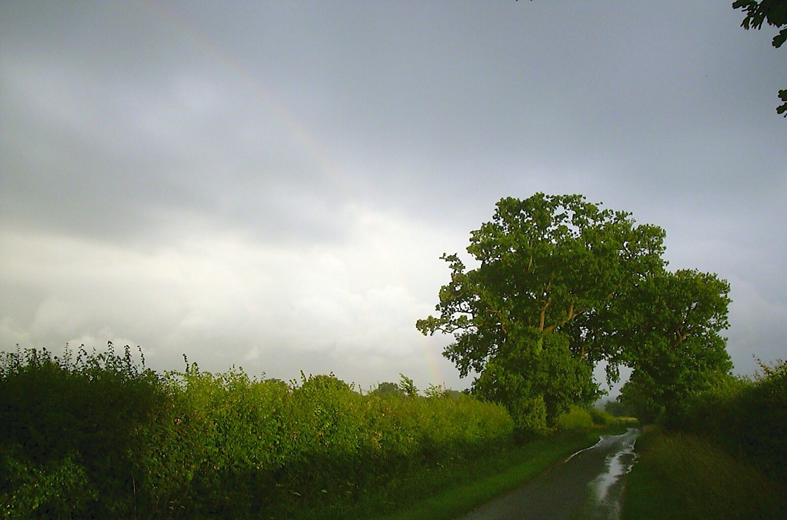 There's a faint rainbow near Billingford from The BSCC Annual Sponsored Bike Ride, The Cottage, Thorpe St. Andrew, Norwich  - 18th July 2004