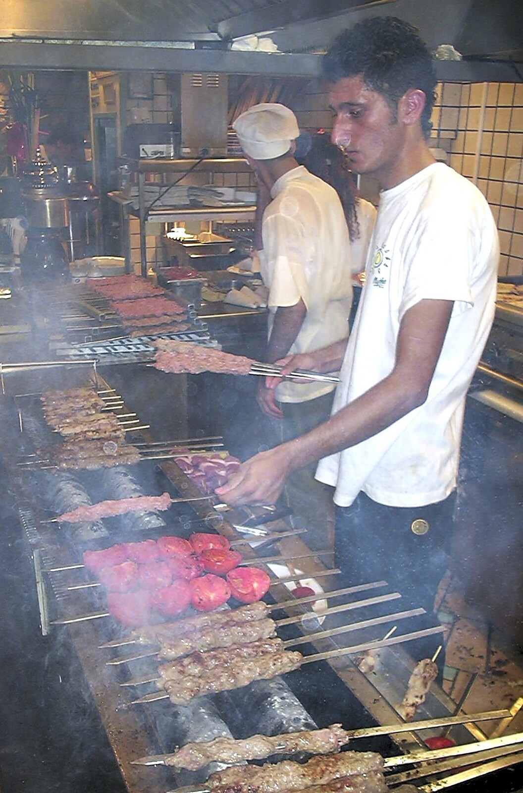 A Postcard From Athens: A Day Trip to the Olympics, Greece - 19th August 2004: Some dudes grill meat on a stick