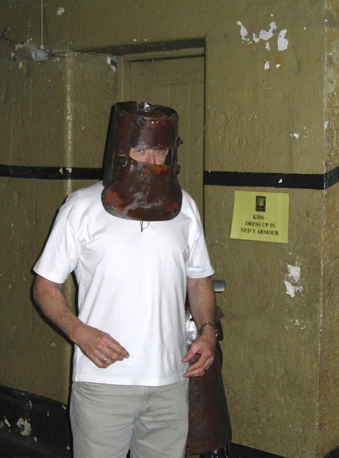 Some dude tries on Ned Kelly's helmet from A Couple of Days in Melbourne, Victoria, Australia - 5th October 2004