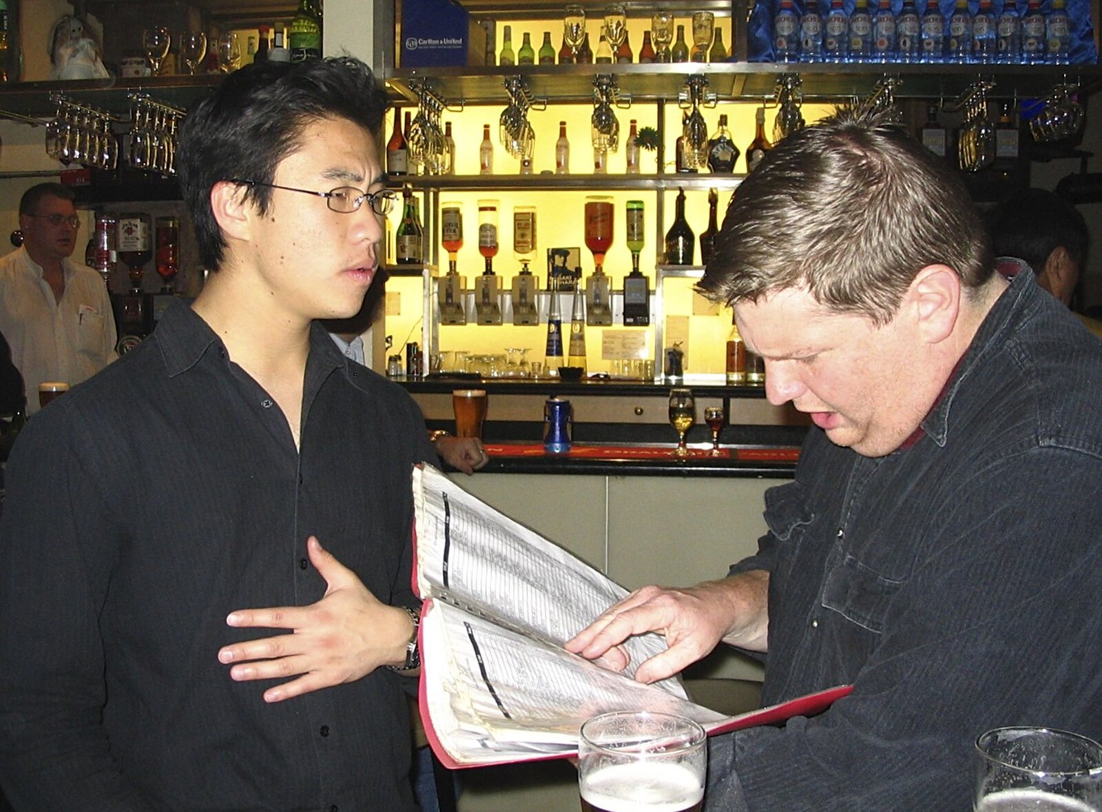 The karaoke list is inspected from Sydney, New South Wales, Australia - 10th October 2004