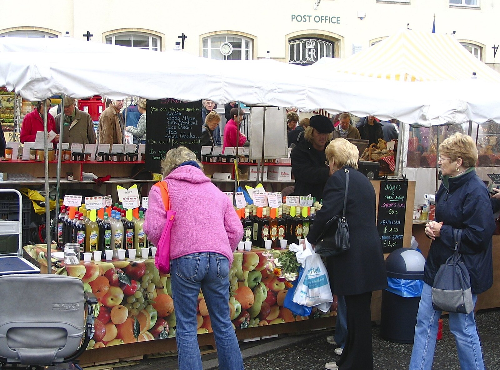 Somebody peers at fruit juices from A French Market, Blues and Curry, Diss, Scole and Brome - 17th October 2004