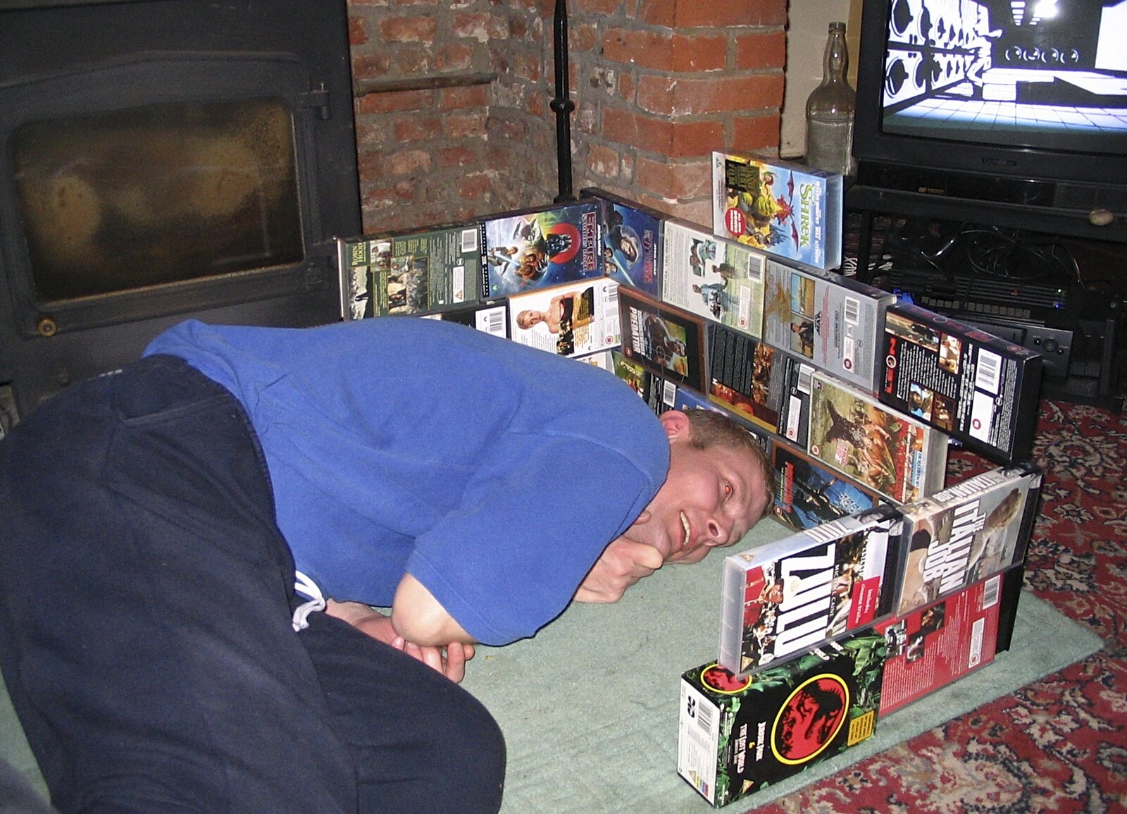 Bill enjoys his fort made of VHS cases from A French Market, Blues and Curry, Diss, Scole and Brome - 17th October 2004