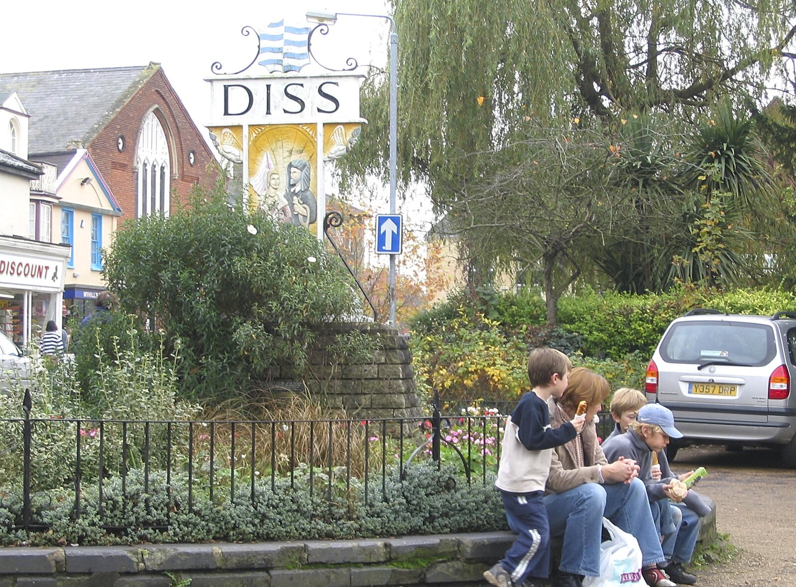 A family eats snacks by the town sign from Feeding the Ducks: a Diss and Norwich Miscellany - 7th November 2004