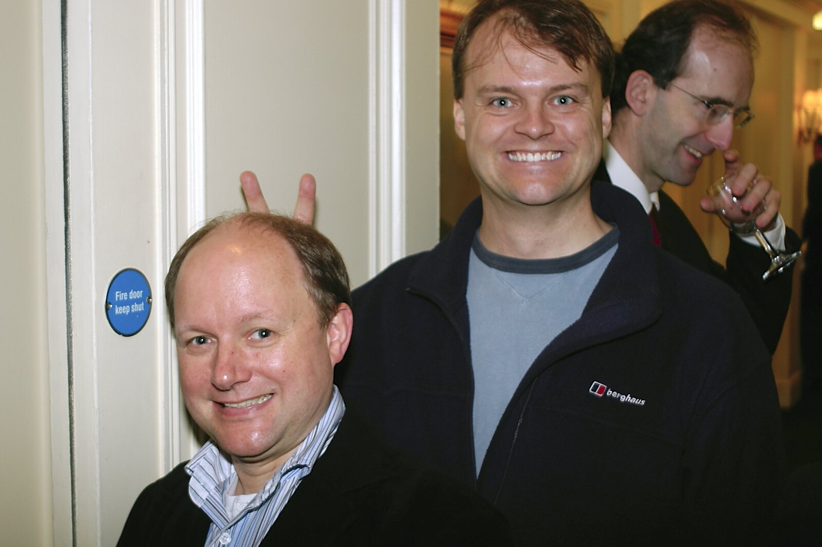 Nick does bunny ears behind Martin from Qualcomm Europe All-Hands, Berkeley Hotel, Knightsbridge - 18th November 2004