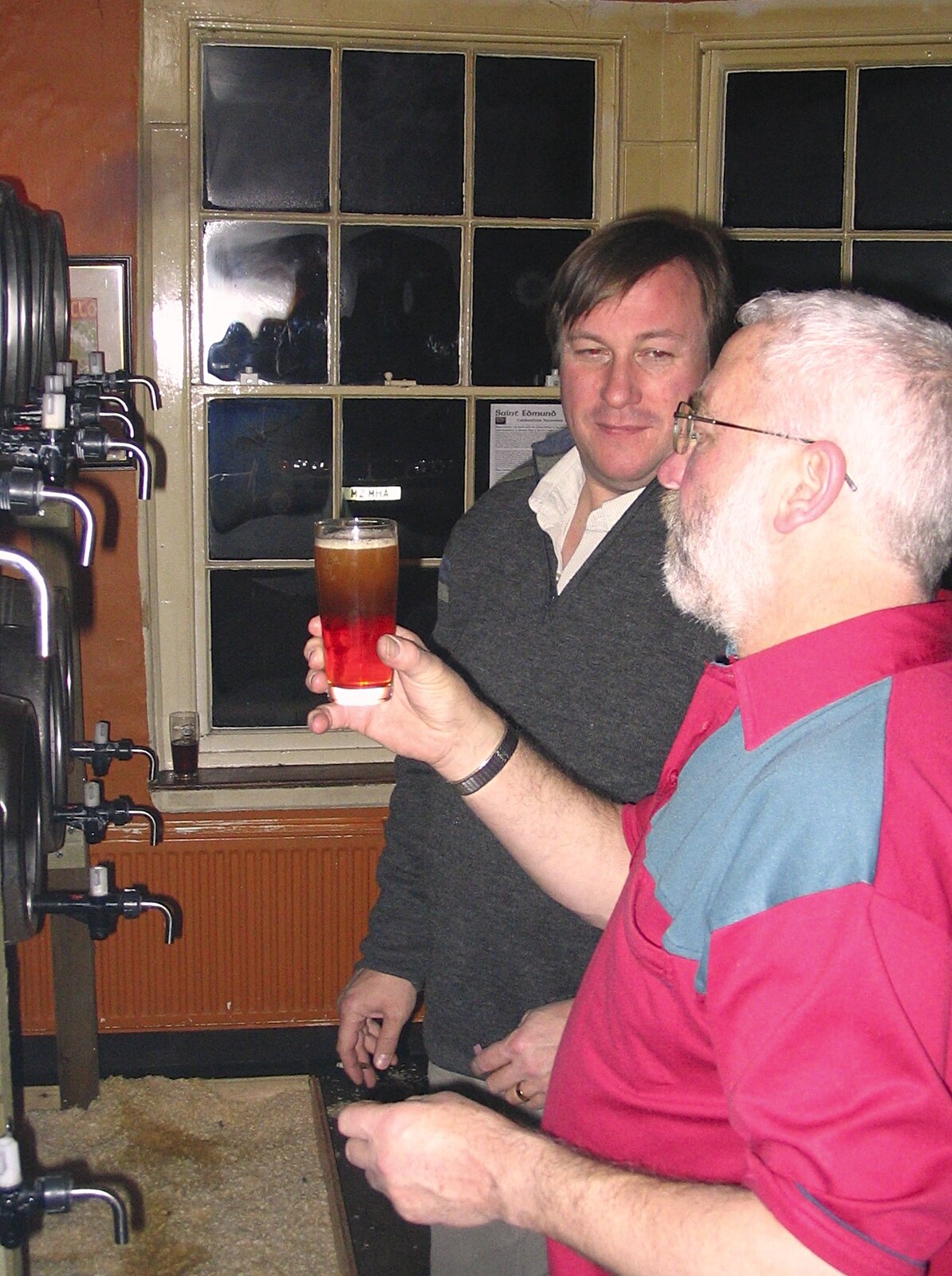 A beer is surveyed from The Hoxne Swan Beer Festival, Hoxne, Suffolk - 20th November 2004