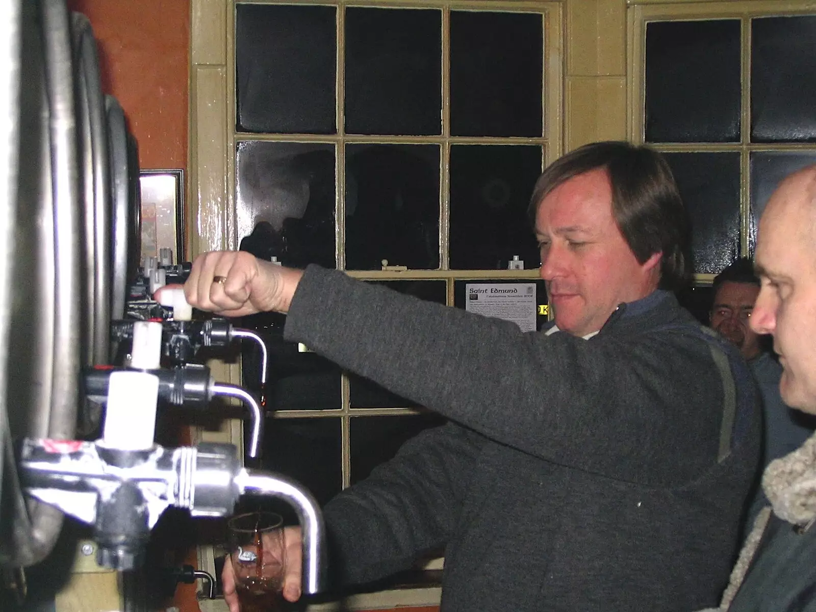 The landlord pours a pint from the barrel, from The Hoxne Swan Beer Festival, Hoxne, Suffolk - 20th November 2004