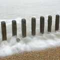 A soft sea laps at a line of wooden stakes, A Trip to East Lane, Bawdsey, Suffolk - 28th November 2004
