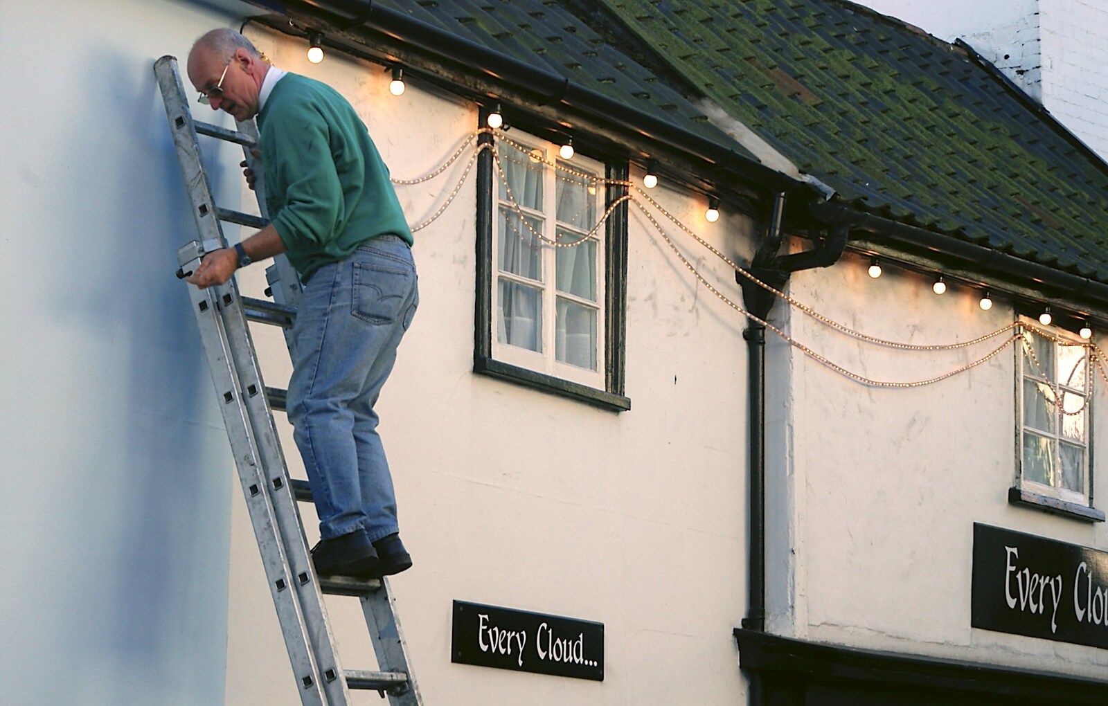 Roger's up a ladder, installing lights from Christmas Lights and St. Mary's Church, Diss, Norfolk - 29th November 2004