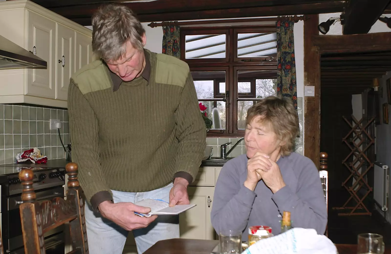 Geoff reads something, from Christmas Shopping and a Carol Service, Norwich and Thrandeston - 19th December 2004