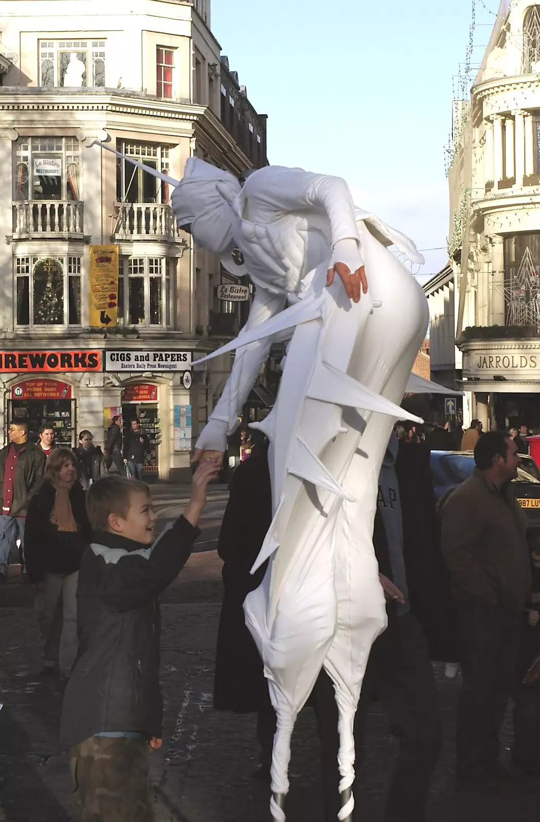 Some weird stilt people roam around, from Christmas Shopping and a Carol Service, Norwich and Thrandeston - 19th December 2004