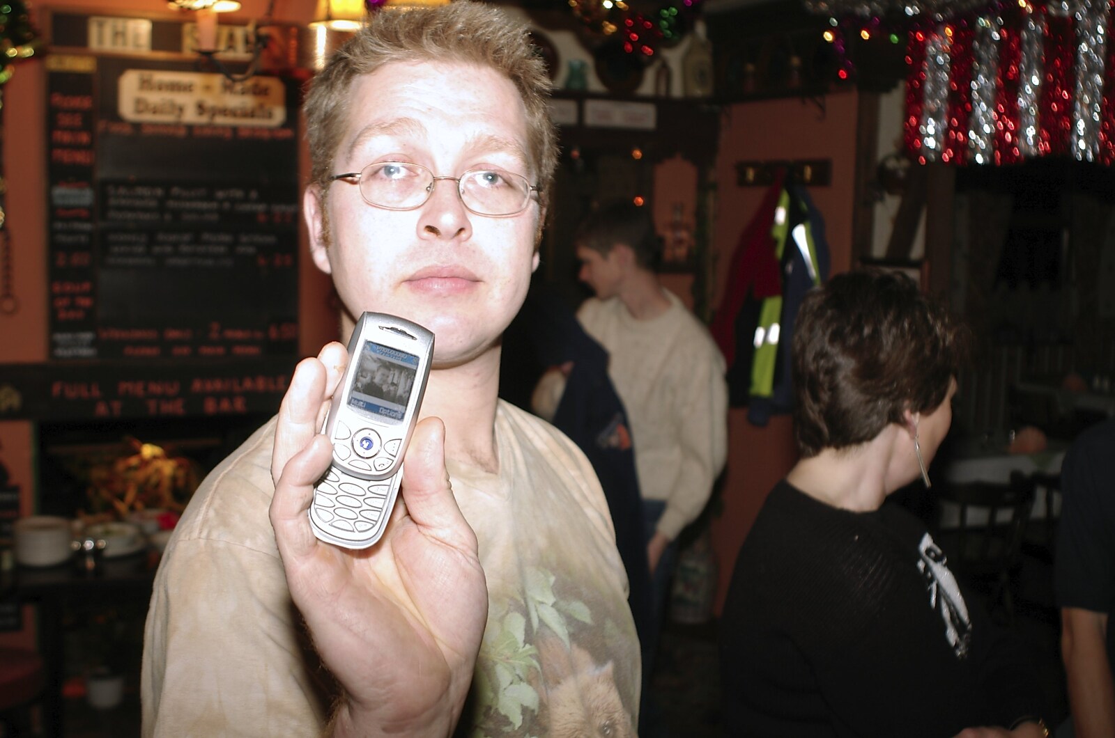 New Year's Eve at The Swan Inn, Brome, Suffolk - 31st December 2004: Marc shows off a mobile phone picture of Nosher